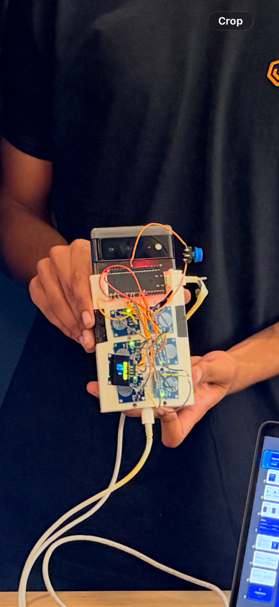 Brailed phone-mounted accessibility controller with six touch sensors, ESP32, OLED, and 3D-printed frame